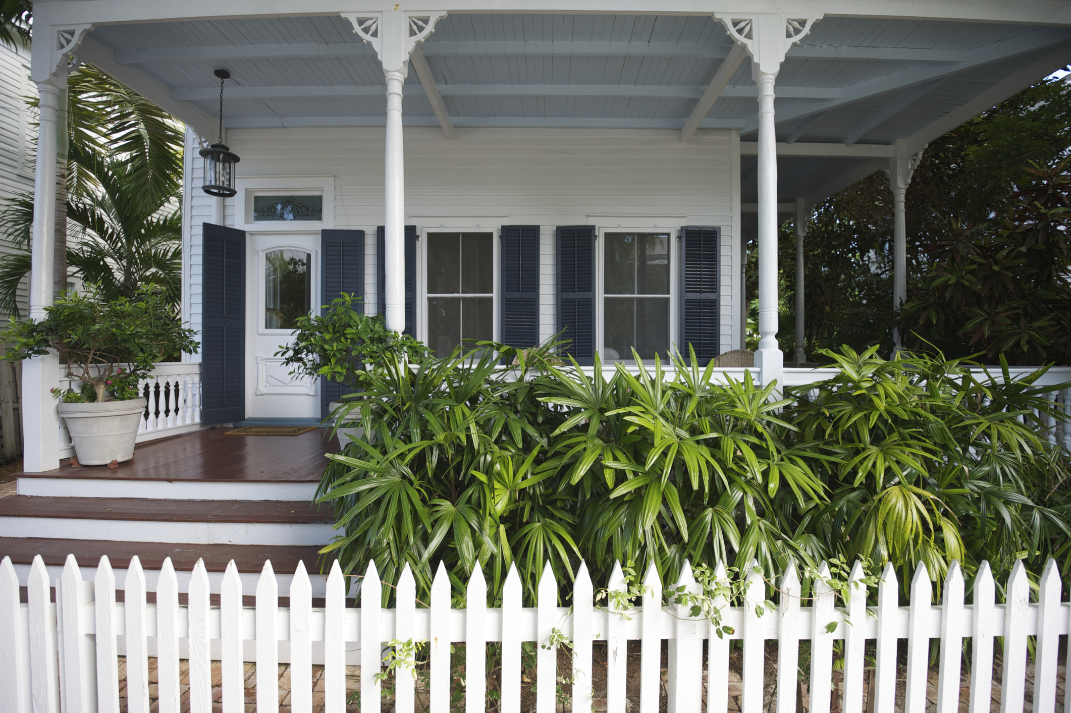 White house porch with blue shutters