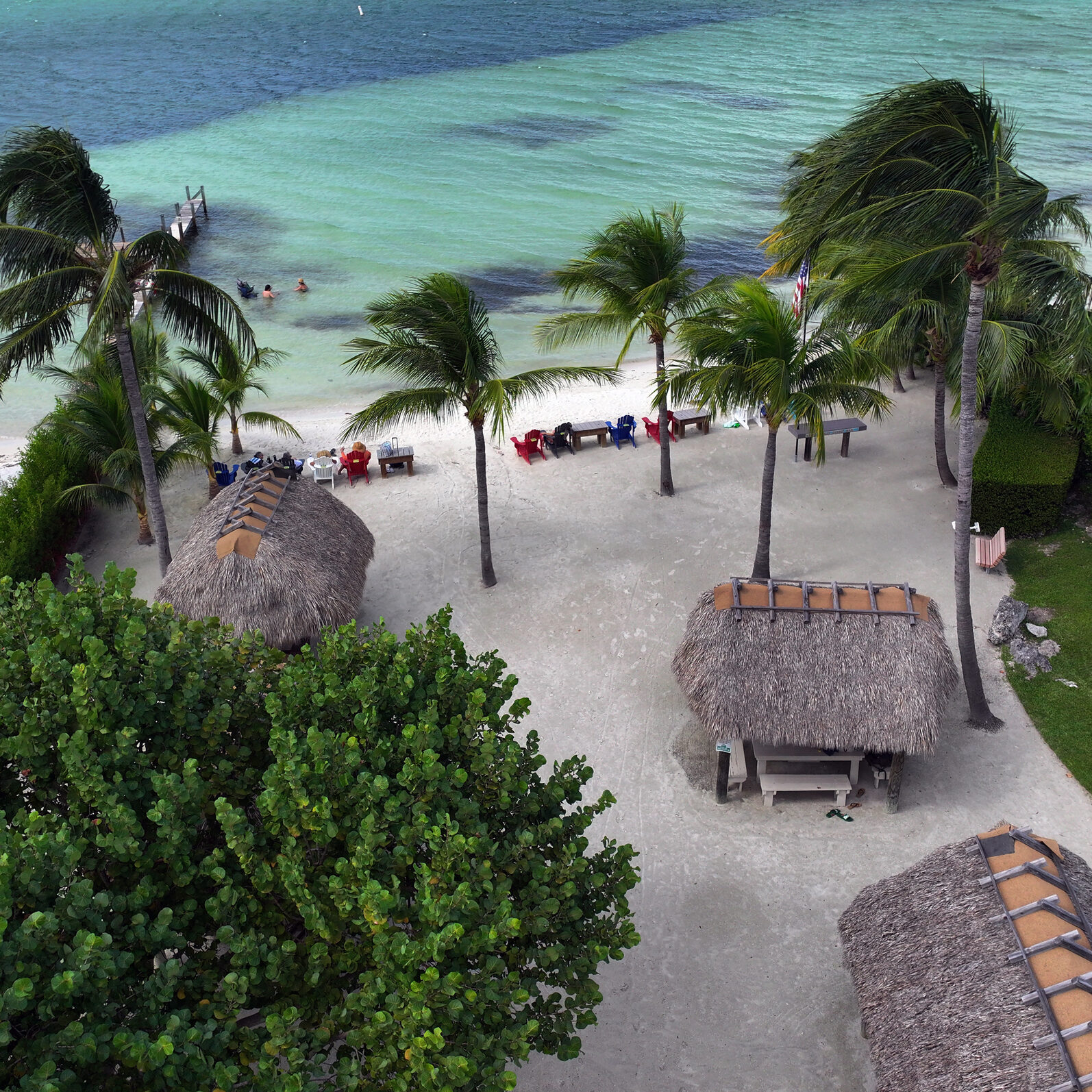 Aerial view of tropical beach with palapas